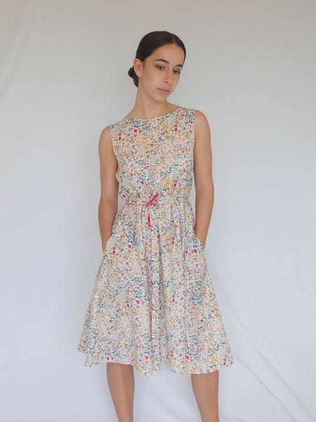 A-line knee length dress in white Liberty cotton delicate floral print. with self tie belt and pockets